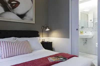 Letto o letti in una camera di B&B Prestigia Rooms