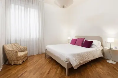 Letto o letti in una camera di UNYCA - Ponte Vecchio Florence Apartment