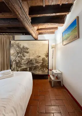 Letto o letti in una camera di Costa San Giorgio, 65 - Gemma Incastonata a pochi passi da Ponte Vecchio