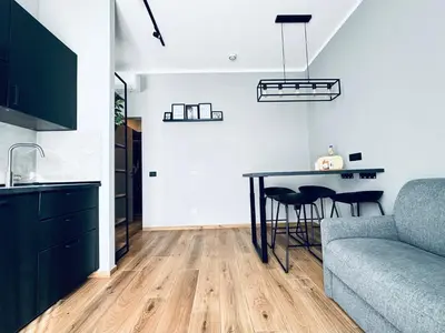 Area soggiorno di M4 BLACK Monolocale Moderno e Funzionale