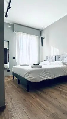 Letto o letti in una camera di M4 BLACK Monolocale Moderno e Funzionale