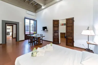 Letto o letti in una camera di UNYCA- Florence Residenza Storica