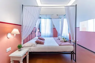 Letto o letti in una camera di UNYCA- Florence Residenza Storica