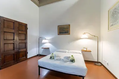 Letto o letti in una camera di UNYCA- Florence Residenza Storica