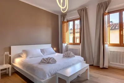 Letto o letti in una camera di Sacha Apartment by Mamo Florence