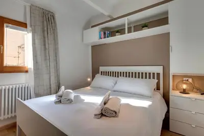 Letto o letti in una camera di Sacha Apartment by Mamo Florence