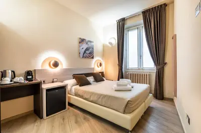 Letto o letti in una camera di Repubblica Suites By San Firenze Collection