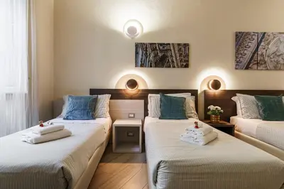 Letto o letti in una camera di Repubblica Suites By San Firenze Collection