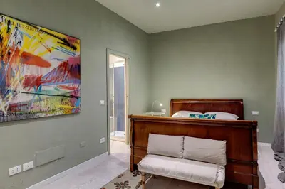 Letto o letti in una camera di Orto Apartment by Mamo Florence