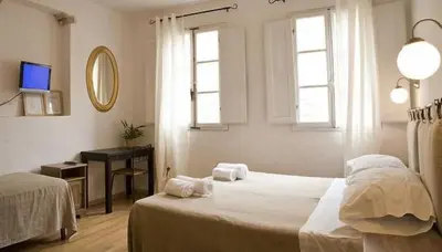 Letto o letti in una camera di San Gallo Guesthouse