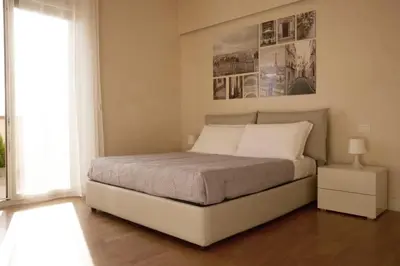 Letto o letti in una camera di Terrazze Raffaello - Attico vista Duomo