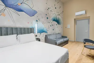 Letto o letti in una camera di Hotel Adamas