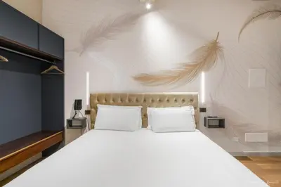 Letto o letti in una camera di Hotel Adamas