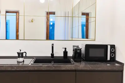 Cucina o angolo cottura di Luxury Suite - 5 minutes walk from the Duomo