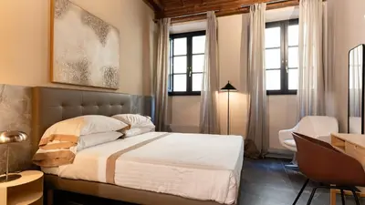 Letto o letti in una camera di Palazzo Santa Monaca