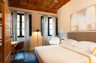 Letto o letti in una camera di Palazzo Santa Monaca
