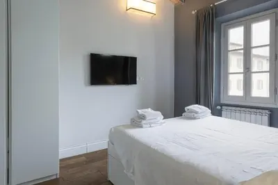 Letto o letti in una camera di Central Nest by MMega