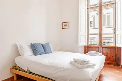 Letto o letti in una camera di Calzaiuoli Sunshine