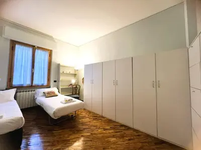 Letto o letti in una camera di Verrazzano House Florence