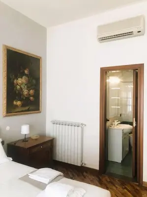 Letto o letti in una camera di Verrazzano House Florence