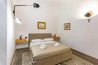 Letto o letti in una camera di GuestHost - San Lorenzo Central Roomy Apartment