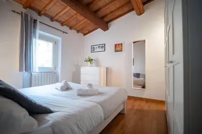 Letto o letti in una camera di San Niccolo Luxury House