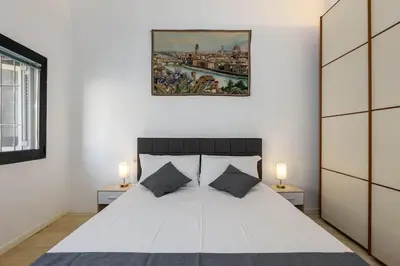 Letto o letti in una camera di Duomo - Grazioso appartamento nel cuore di Firenze