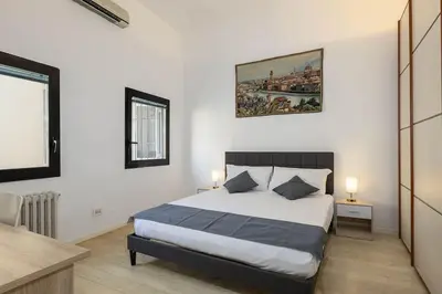 Letto o letti in una camera di Duomo - Grazioso appartamento nel cuore di Firenze