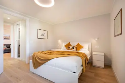 Letto o letti in una camera di Alfieri Apartment