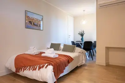 Letto o letti in una camera di Alfieri Apartment