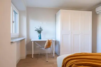 Letto o letti in una camera di Alfieri Apartment