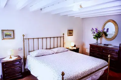 Letto o letti in una camera di Bioagriturismo Podere Montisi