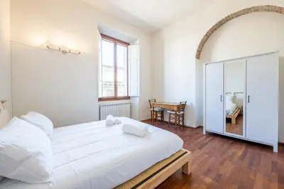 Letto o letti in una camera di Oasi Brunelleschi - 20 Passi da Piazza del Duomo