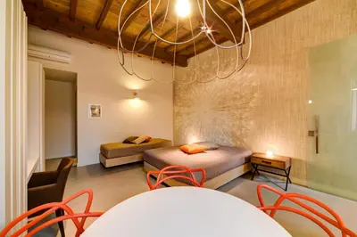 Letto o letti in una camera di Palazzo Mannaioni Suites