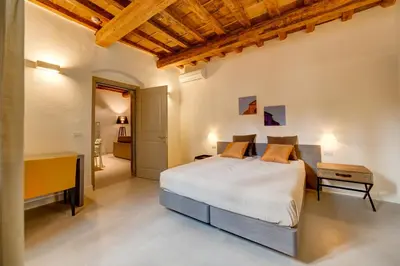 Letto o letti in una camera di Palazzo Mannaioni Suites