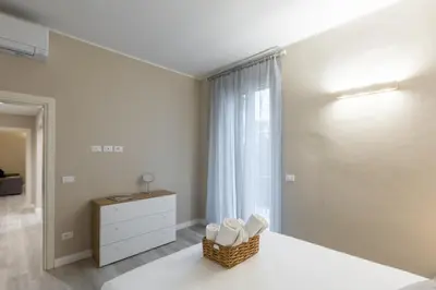 Letto o letti in una camera di Bianca - Roby - Paolo Apartments by Mamo Florence