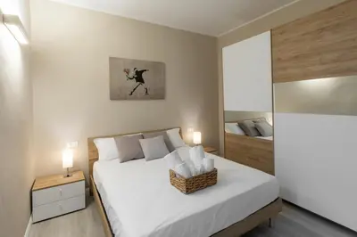 Letto o letti in una camera di Bianca - Roby - Paolo Apartments by Mamo Florence