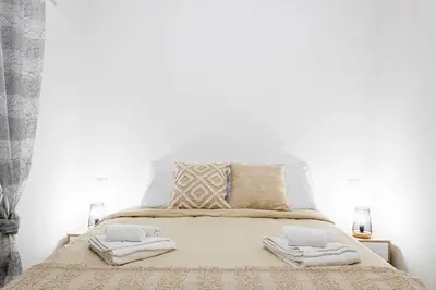 Letto o letti in una camera di The Luxor Suites - Rosina