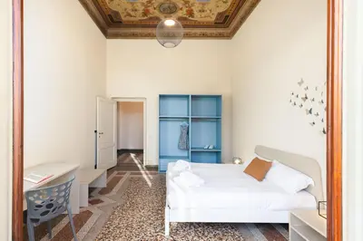 Letto o letti in una camera di Panoramic Home 5 min ponte vecchio and center