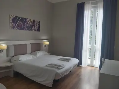 Letto o letti in una camera di Lodges le Mura 2