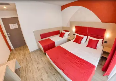 Letto o letti in una camera di Hotel Luxor Florence