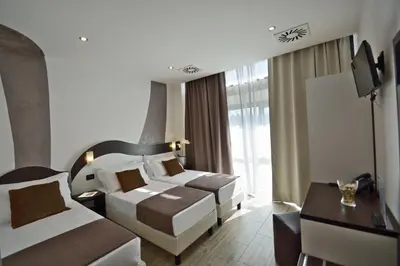 Letto o letti in una camera di Hotel Luxor Florence
