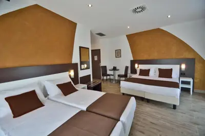 Letto o letti in una camera di Hotel Luxor Florence