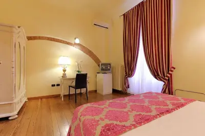 Letto o letti in una camera di Relais Lavagnini Florence