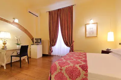Letto o letti in una camera di Relais Lavagnini Florence