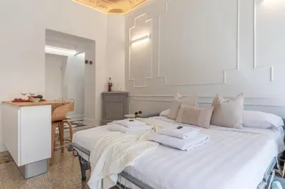 Letto o letti in una camera di NEW - Pietrapiana Five Senses - City Center