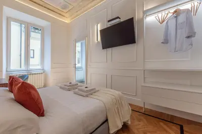 Letto o letti in una camera di NEW - Pietrapiana Five Senses - City Center