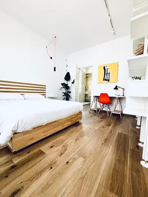 Letto o letti in una camera di M4 WHITE Monolocale Moderno e Funzionale