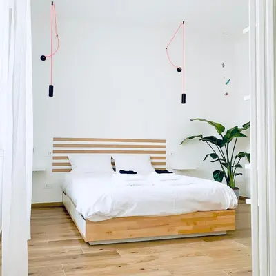 Letto o letti in una camera di M4 WHITE Monolocale Moderno e Funzionale