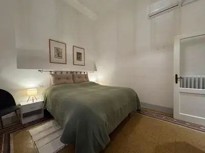 Letto o letti in una camera di Ambrogio 33 - three bedrooms three bathrooms